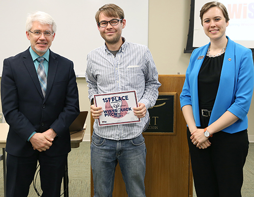 Richard “D.J” Shipman, at center, with UW-Stout Provost Patrick Guilfoile and Kristen Ruka, regional associate for WiSys Technology Foundation. Shipman won the UW-Stout WiSys Quick Pitch competition May 2.